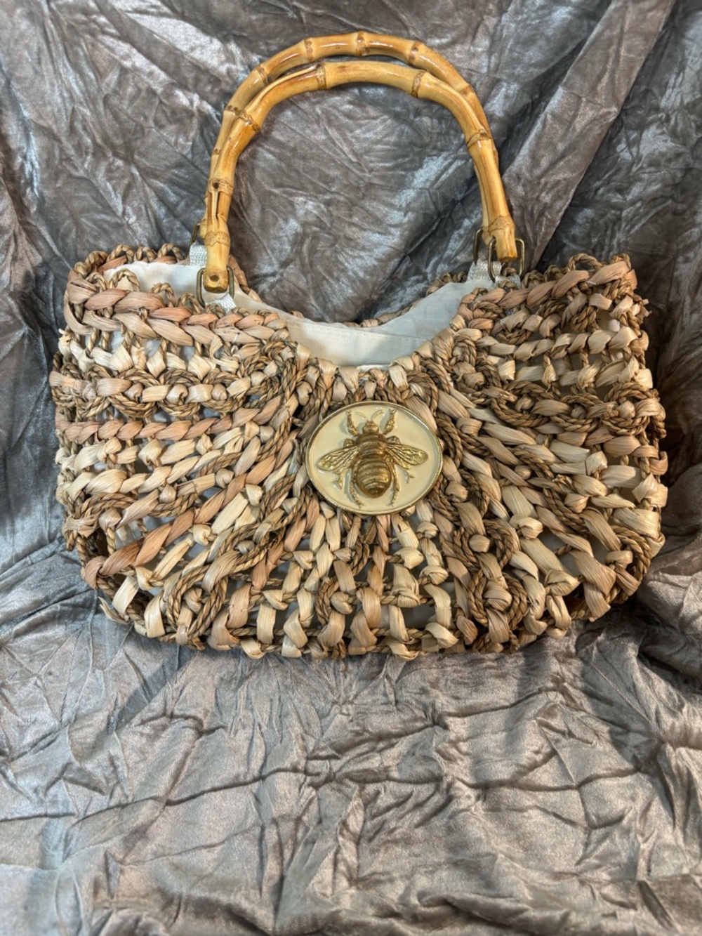 Handwoven Natural Straw Shoulder Bag with Bamboo Handles and Bee Medallion